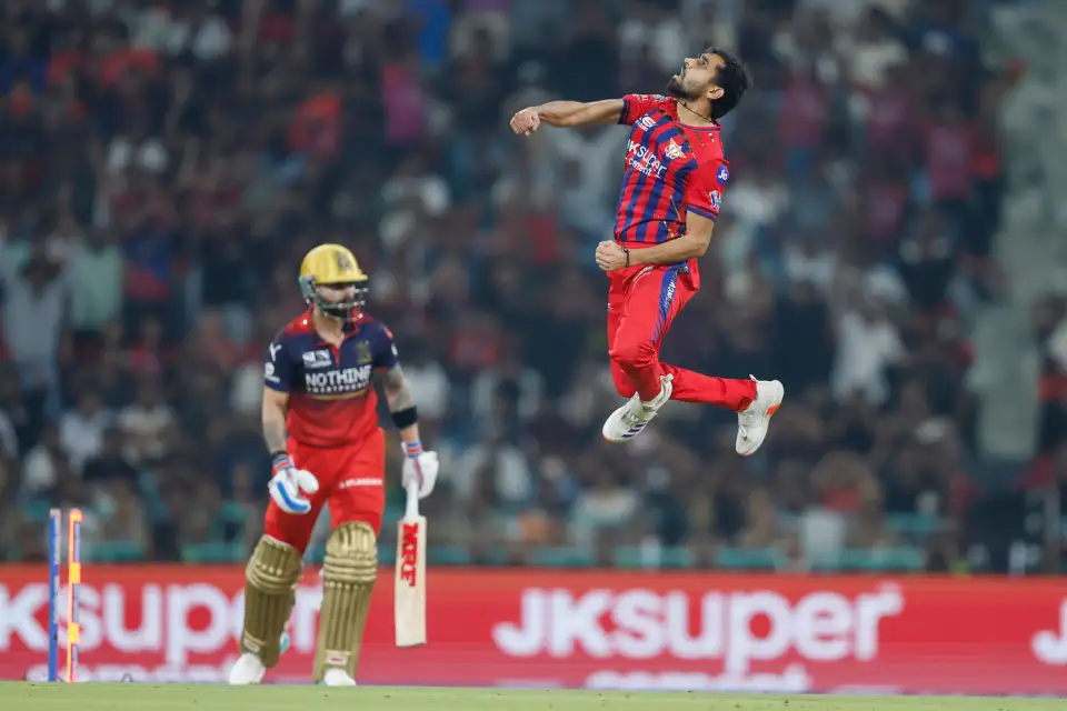 Lucknow Super Giants batter Mitchell Marsh celebrates his century against Royal Challengers Bengaluru in IPL 2026.