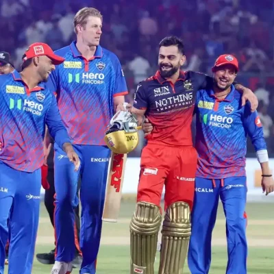 Royal Challengers Bengaluru players celebrate a dominant 9-wicket win over Delhi Capitals in IPL 2026 Match 39.