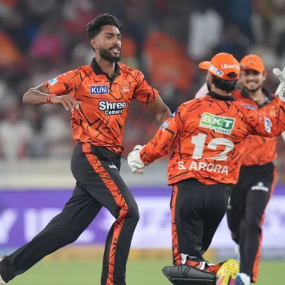 Sunrisers Hyderabad players celebrate victory after defeating Rajasthan Royals in Match 21 of IPL, showcasing strong team performance on the field.